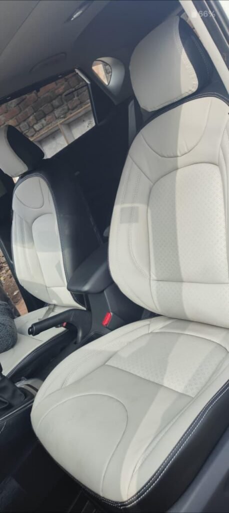 "Interior view of a car featuring Perfect Premium Car Seat Covers with a custom-fit design, tailored specifically to the car's cabin for a seamless and luxury finish."